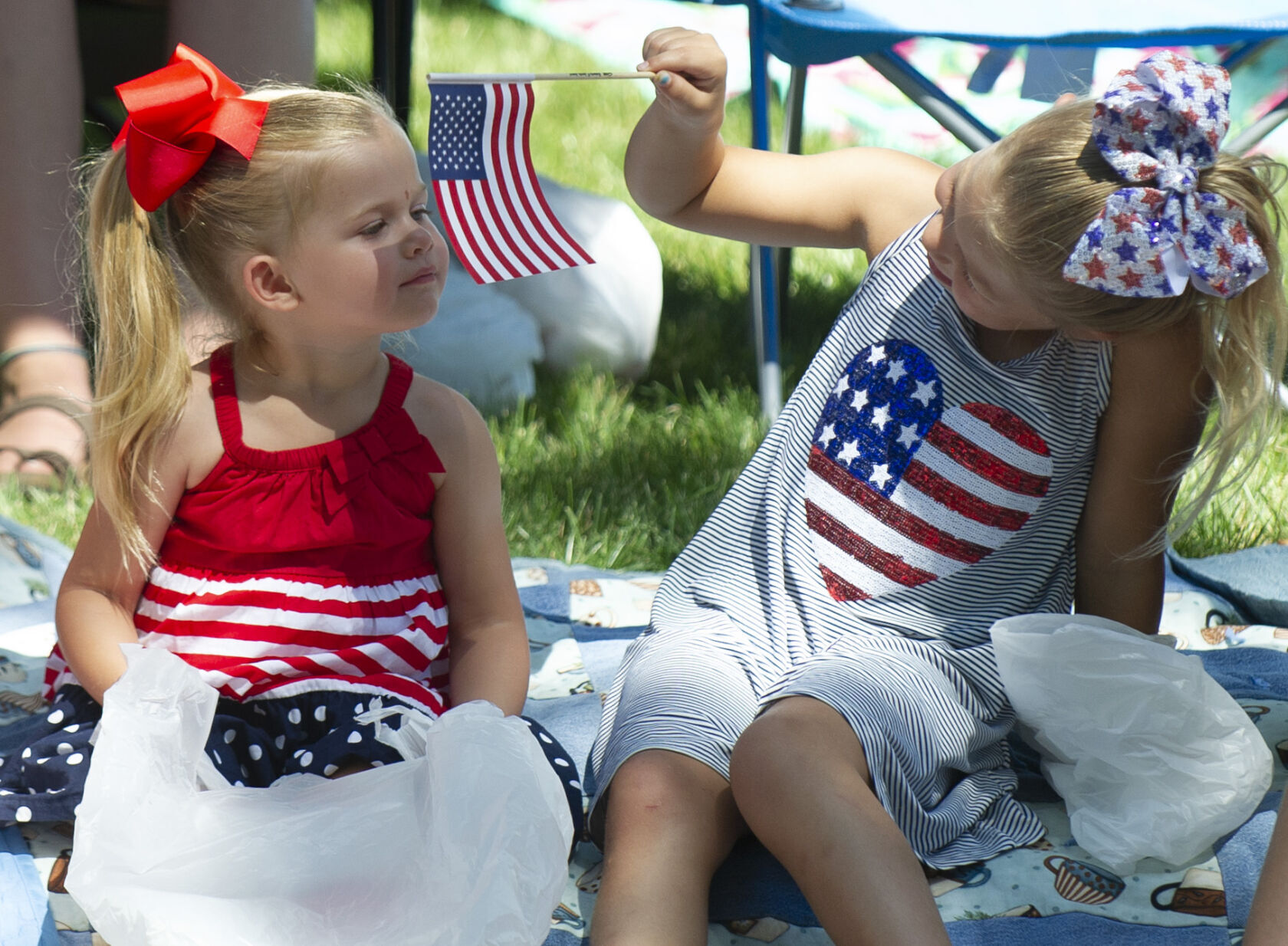 Girls in Seward with US flag